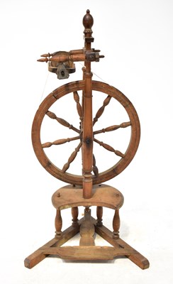Lot 332 - A 19th century treadle spinning wheel with...