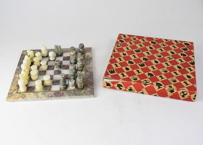 Lot 207 - A boxed hardstone chess set, board 25 x 25cm...