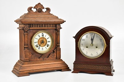 Lot 2389 - A 19th century oak mantel clock with white...