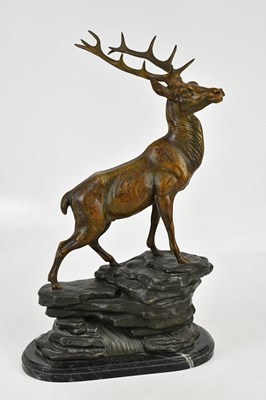 Lot 1412 - L CARVIN; a bronzed spelter figure of a stag,...