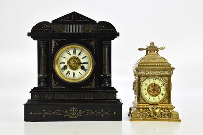 Lot 2258 - A late 19th century French brass mantel clock,...