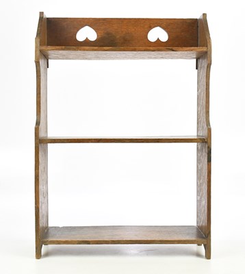 Lot 2022 - An Arts & Crafts light oak hanging three tier...