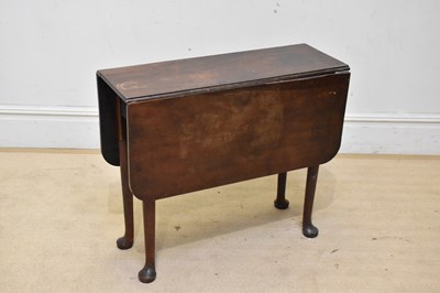 Lot 2192 - A George III mahogany drop-leaf dining table,...