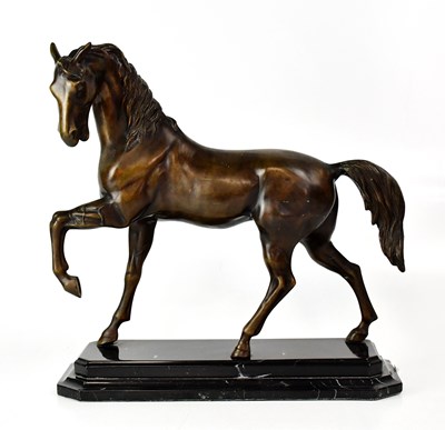 Lot 287 - A bronze figure of a horse on black marble...