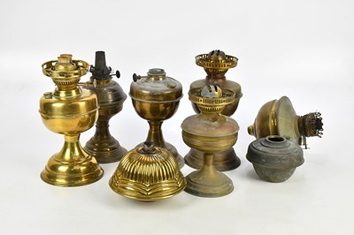 Lot 2422 - A collection of various brass oil lamp...