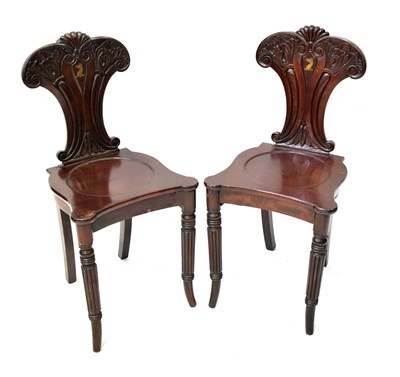 Lot 27 - A pair of 19th century hall chairs, the...