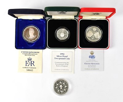 Lot 992 - Four silver proof commemorative coins,...