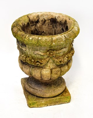 Lot 121 - A reconstituted stone garden urn of Classical...