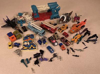 Lot 124 - HASBRO TRANSFORMERS; a quantity of 1980s toys,...