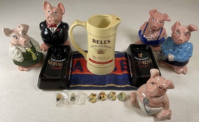 Lot 77 - A group of Wade Nat West piggy banks, all with...
