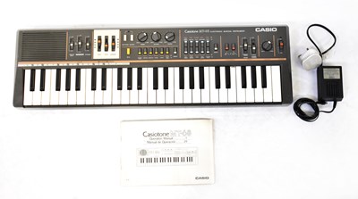 Lot 794 - CASIO; a vintage boxed Casiotone MT-68...