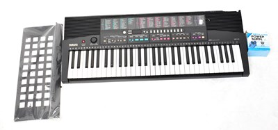 Lot 795 - YAMAHA; an electronic PSR-215 keyboard, with...