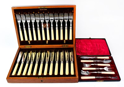 Lot 874 - An oak cased twelve-setting fish server set...