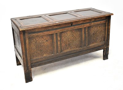 Lot 98 - An 18th century and later oak triple-panelled...