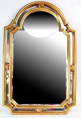 Lot 136A - A contemporary gilt framed shaped wall mirror,...