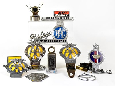 Lot 373 - A collection of car badges, to include Daimler,...
