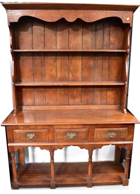 Lot 100 - An early 20th century oak dresser, the upper...