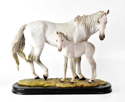 Lot 295 - A contemporary resin figure group of a white...