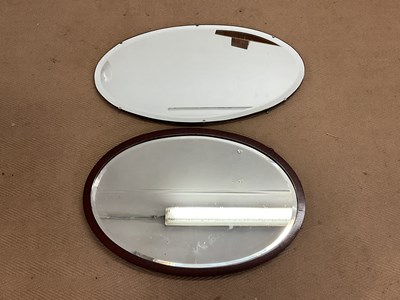 Lot 749 - Two early 20th century oval wall mirrors,...