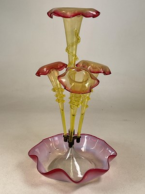 Lot 230 - A late 19th century cranberry tinted epergne,...