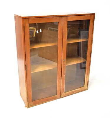 Lot 67 - A mid-20th century teak floorstanding glazed...