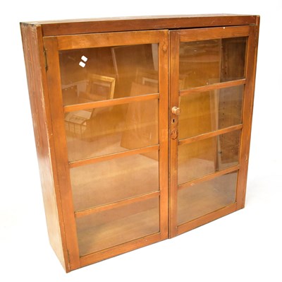 Lot 68 - An early/mid-20th century pine glazed cupboard,...