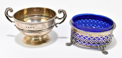 Lot 1098 - An Edwardian pierced hallmarked silver dish with blue glass liner