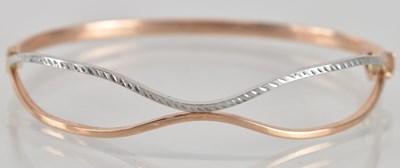 Lot 1620 - A 9ct gold contemporary hinged bracelet, the...