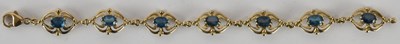 Lot 1608 - A 9ct gold bracelet with seven fancy oval...