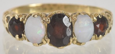 Lot 1355 - A 9ct gold dress ring set with three graduated...