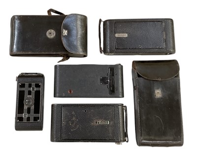Lot 432 - A collection of four Kodak folding cameras...