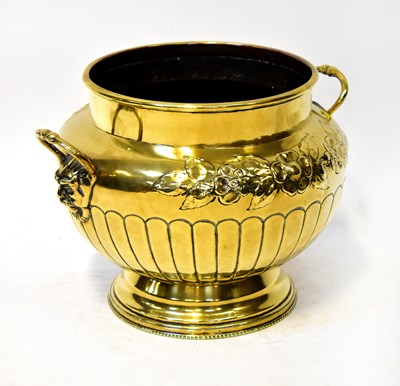 Lot 853 - A 19th century large brass planter, with two...