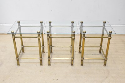 Lot 2089 - Three contemporary brass framed glass topped...