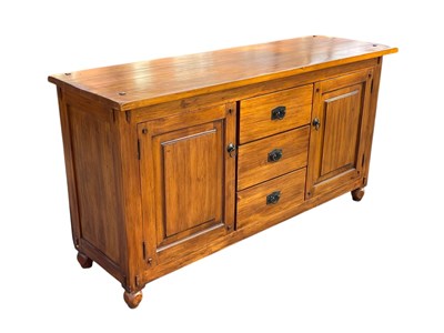 Lot 2041 - A modern hardwood sideboard, with three...