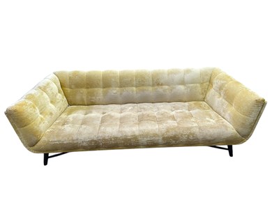 Lot 2037 - A modern three seater sofa, with pale gold...
