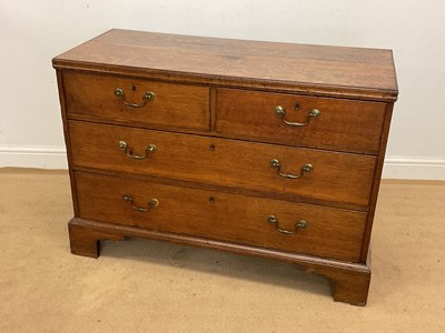 Lot 706 - A Georgian oak chest of two short over two...