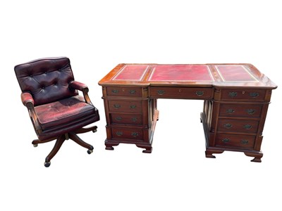 Lot 2071 - A reproduction kneehole twin pedestal...