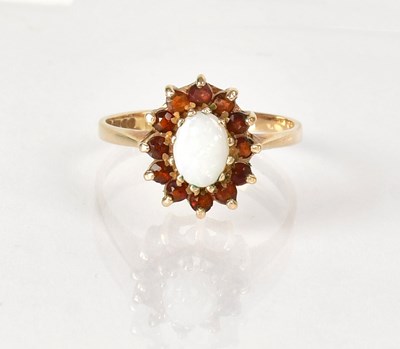 Lot 1040 - A 9ct gold cluster ring set with central opal...