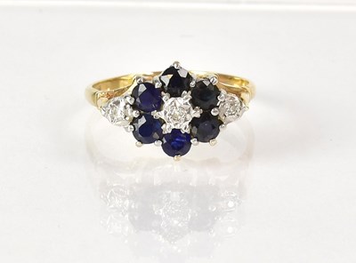Lot 1041 - A 9ct gold cluster ring set with central...