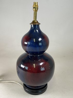 Lot 661 - A blue and red glazed ceramic double gourd...