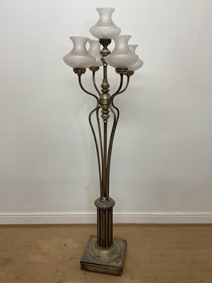 Lot 662 - A metal four branch floor lamp with a centre...