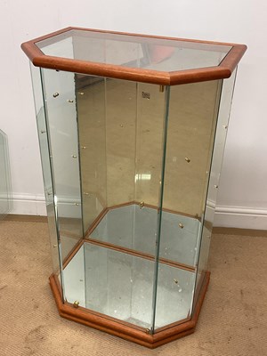 Lot 733 - A modern glass display cabinet with three...