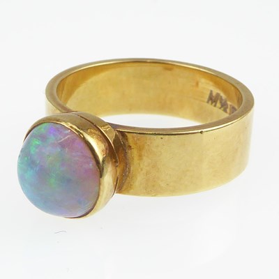 Lot 1026 - An 18ct gold contemporary opal ring, bezel set...