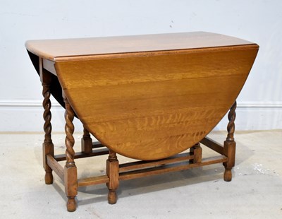 Lot 2068 - An oak gateleg table, on barley twist legs,...