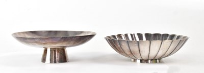 Lot 276 - Two Japanese silver sake dishes, one raised on...