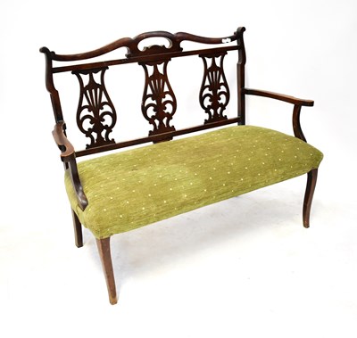 Lot 37 - An Edwardian mahogany settee, the back with...