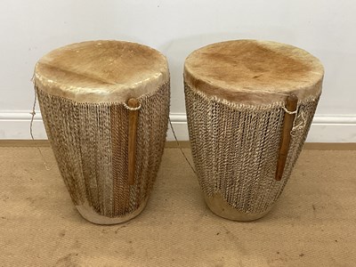 Lot 146 - A pair of African leather hide drums, height...