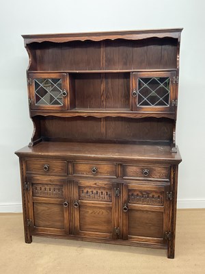 Lot 764 - An oak dresser with carved panels, height...