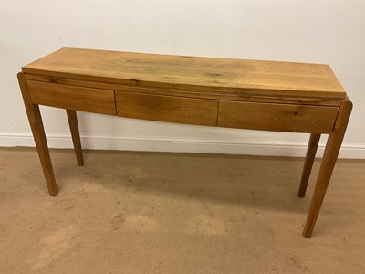 Lot 737 - A modern light oak hall table with three...