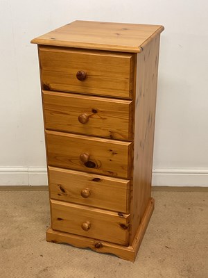 Lot 740 - A pine narrow chest of five drawers, height...